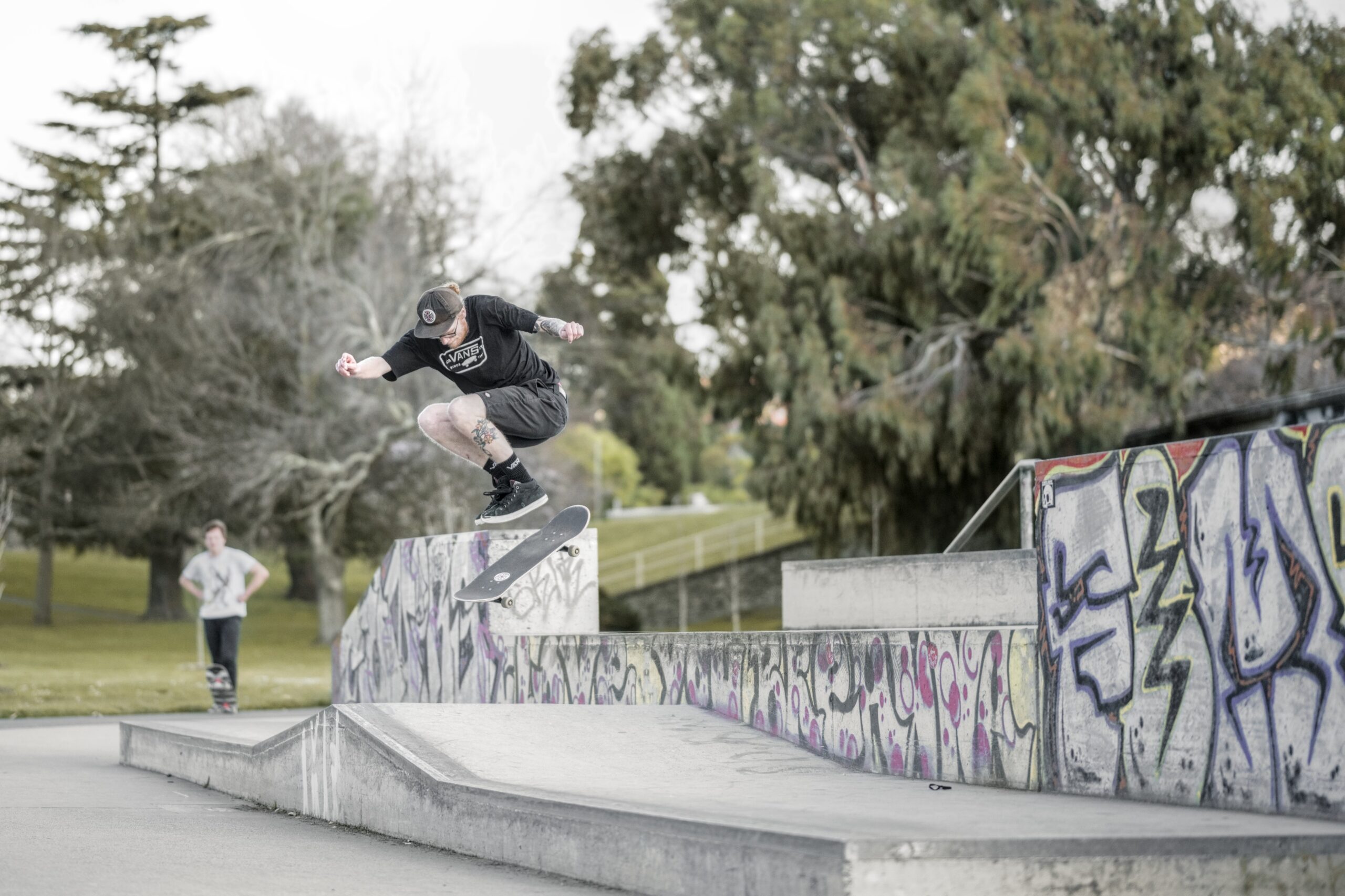 Photo of a skater in mid air doing a pop shuv-it